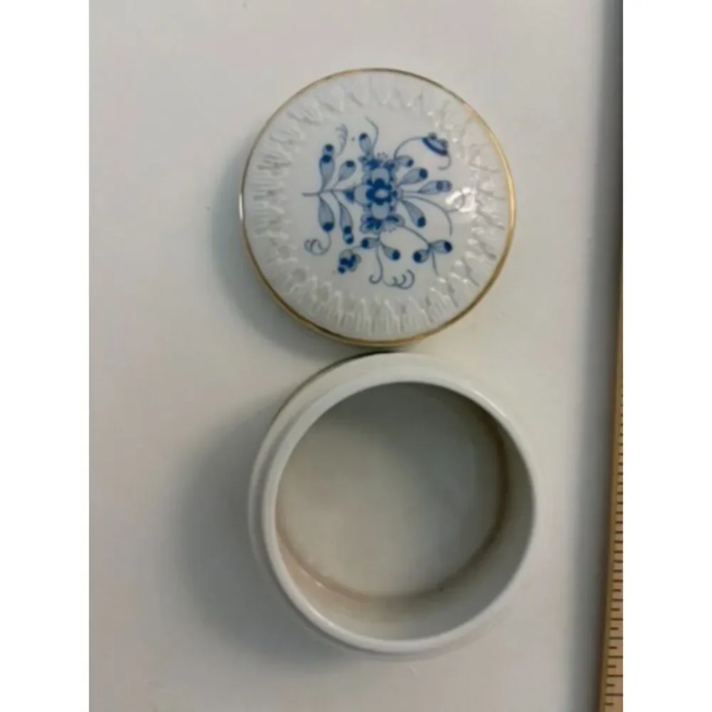 Round blue and white floral porcelain trinket box with gold trim